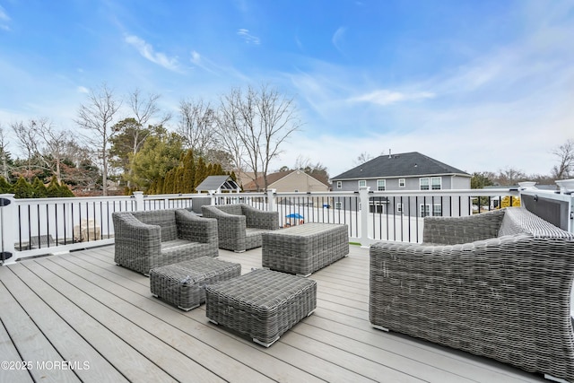 wooden deck featuring an outdoor hangout area