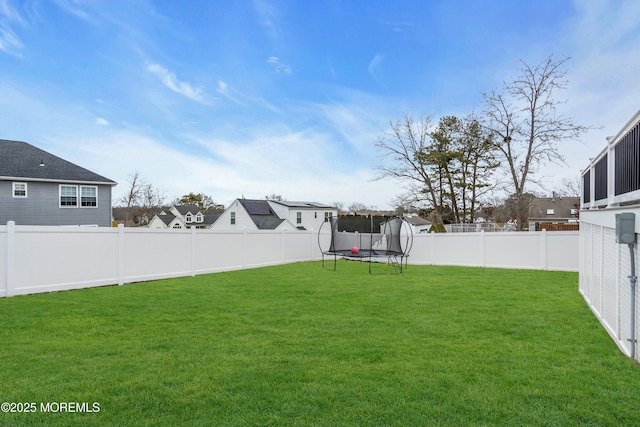 view of yard with a trampoline