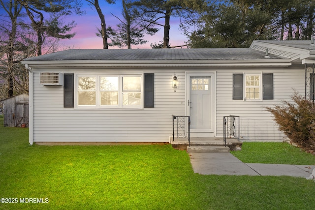 view of front of house with a yard