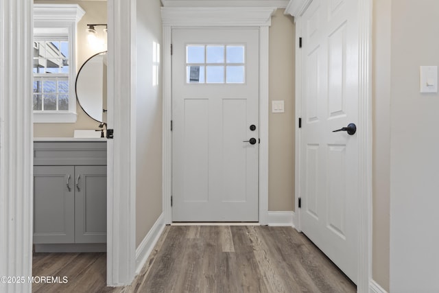 doorway to outside featuring hardwood / wood-style floors and a healthy amount of sunlight