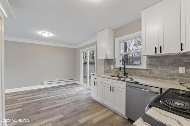 kitchen with sink, stainless steel dishwasher, ornamental molding, white cabinets, and a baseboard heating unit