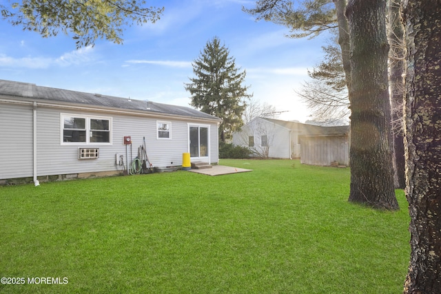 rear view of property with a yard