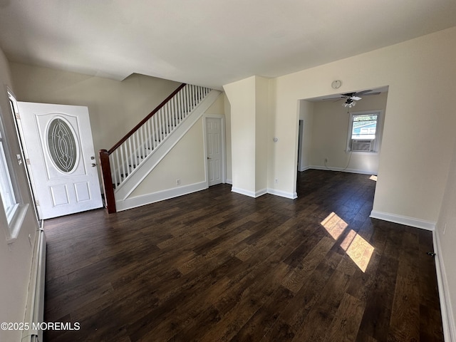 unfurnished living room with dark hardwood / wood-style flooring, cooling unit, and ceiling fan