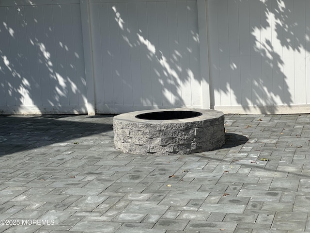 view of patio with an outdoor fire pit