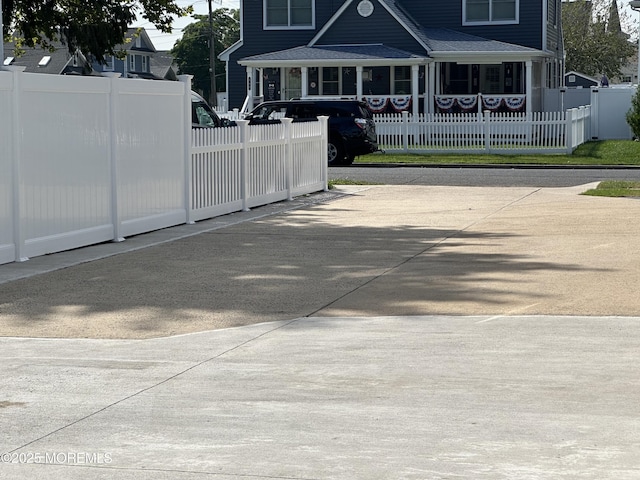 view of gate featuring covered porch