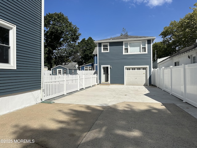 view of home's exterior featuring a garage and a patio