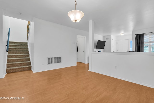 unfurnished living room featuring light wood-type flooring