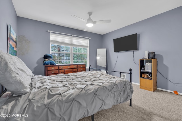 bedroom with ceiling fan and carpet flooring