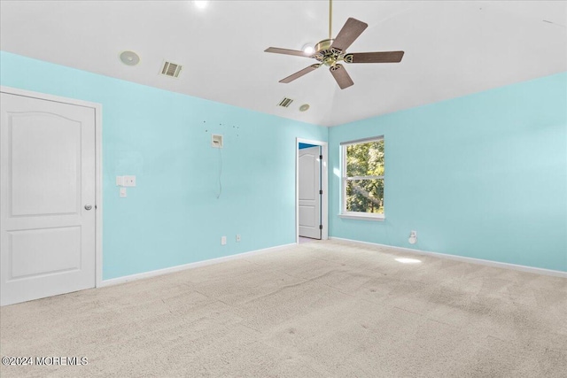 unfurnished room with light colored carpet and ceiling fan