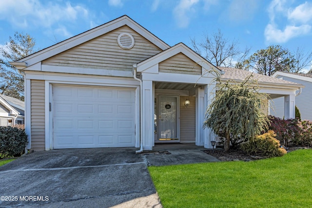 view of front of house with a front yard and a garage