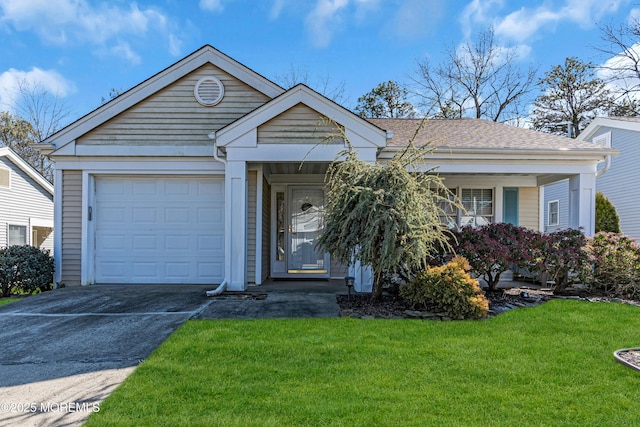 view of front facade with a front lawn and a garage