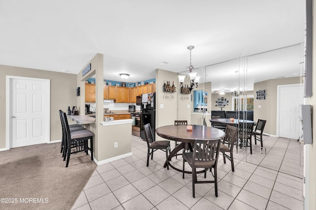 dining area featuring light tile patterned flooring