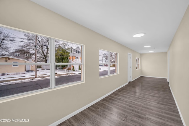 hallway with dark wood-type flooring