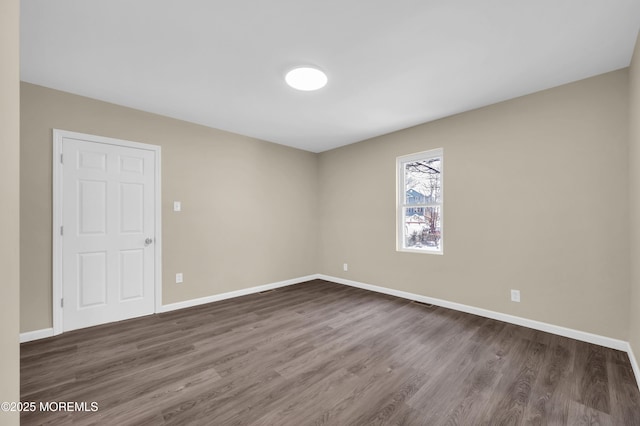 unfurnished room featuring dark hardwood / wood-style floors