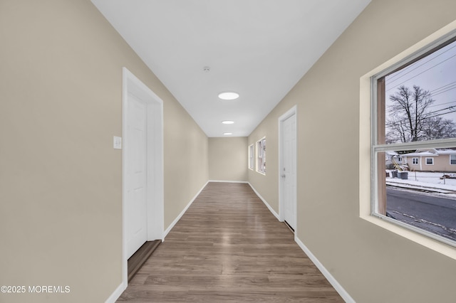 hallway with wood-type flooring