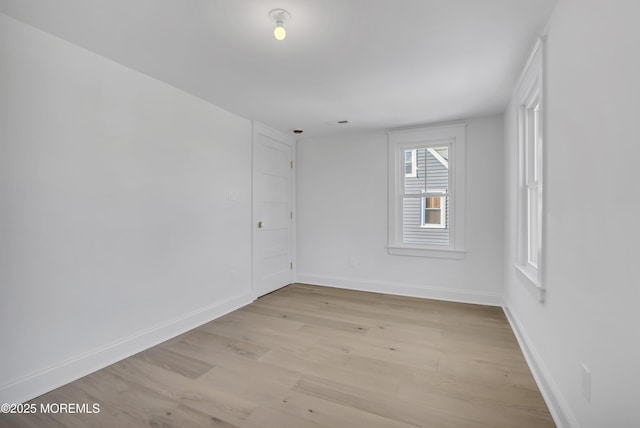 unfurnished room featuring light hardwood / wood-style flooring