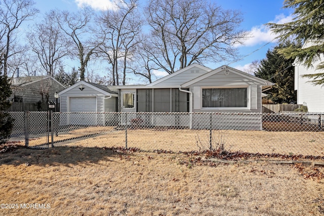 ranch-style home with a garage and a front lawn