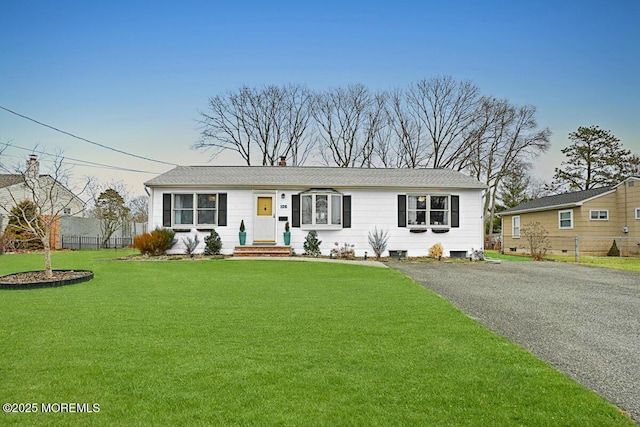 ranch-style home with a front yard