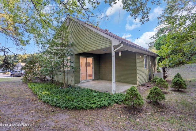 rear view of property featuring a patio