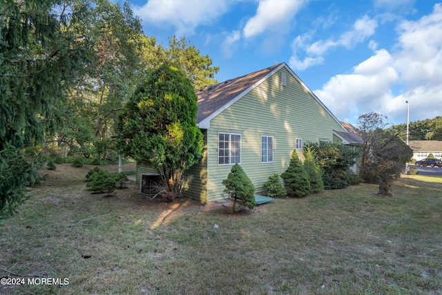 view of home's exterior featuring a lawn