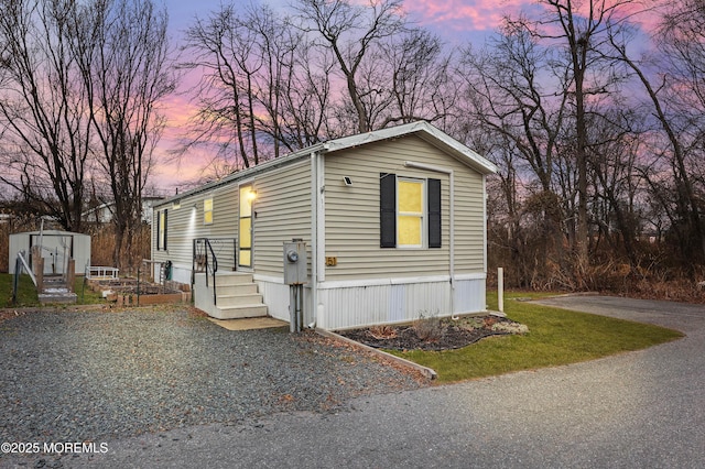 manufactured / mobile home featuring a shed