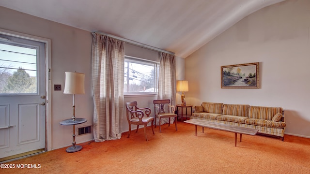 carpeted living area with vaulted ceiling, visible vents, and baseboards