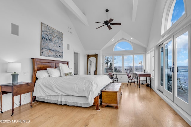 bedroom with light wood finished floors, ceiling fan, access to exterior, high vaulted ceiling, and beam ceiling