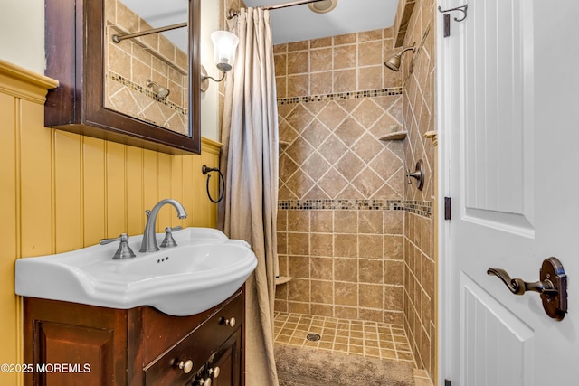 bathroom featuring a shower stall and vanity