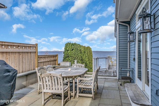 view of patio / terrace featuring fence, outdoor dining area, and area for grilling