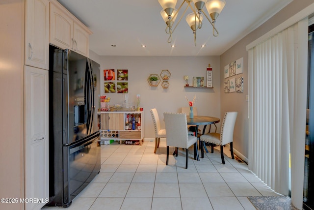 tiled dining area with an inviting chandelier