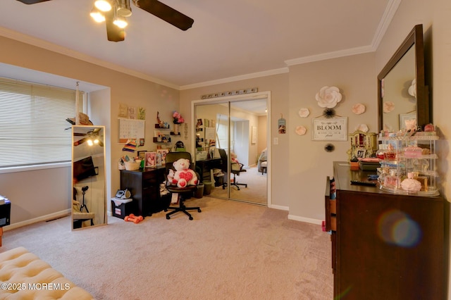 carpeted office space with crown molding and ceiling fan