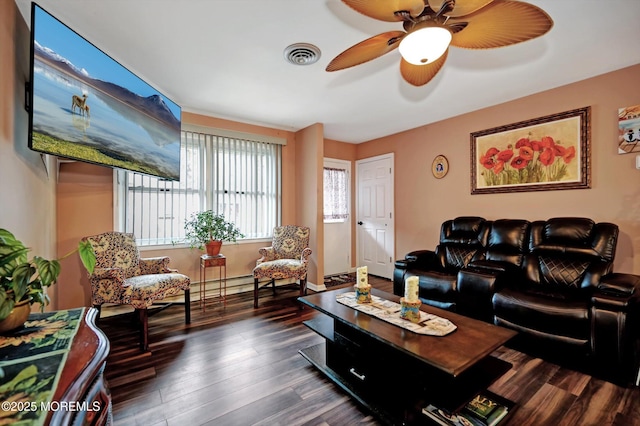 living room featuring ceiling fan and dark hardwood / wood-style floors