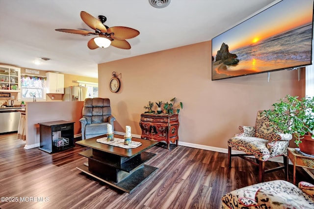 living room featuring wood-type flooring and ceiling fan