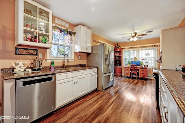 kitchen featuring white cabinetry, sink, dark hardwood / wood-style flooring, and appliances with stainless steel finishes