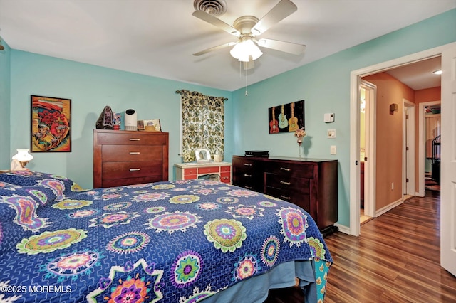 bedroom featuring hardwood / wood-style flooring and ceiling fan