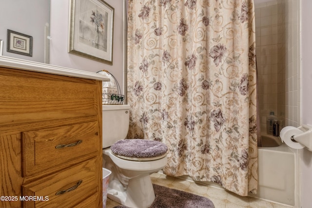 bathroom with shower / tub combo with curtain, toilet, and tile patterned floors