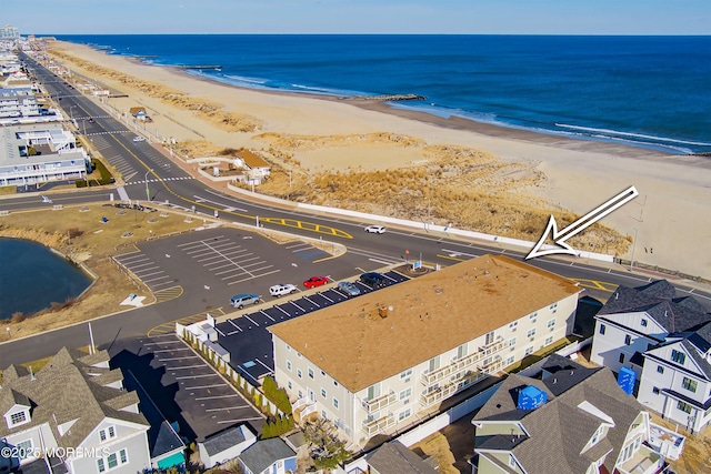 bird's eye view featuring a beach view and a water view