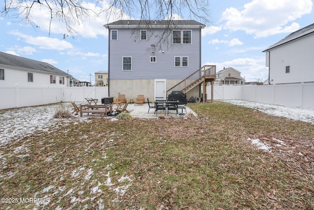 rear view of house with a yard and a patio area