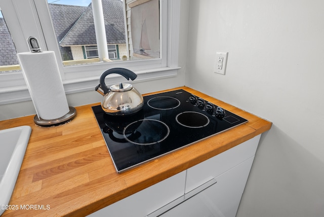 room details featuring black electric cooktop