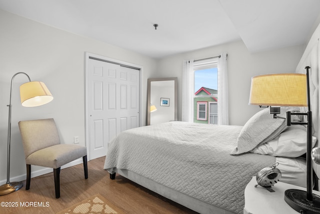 bedroom with a closet and wood finished floors