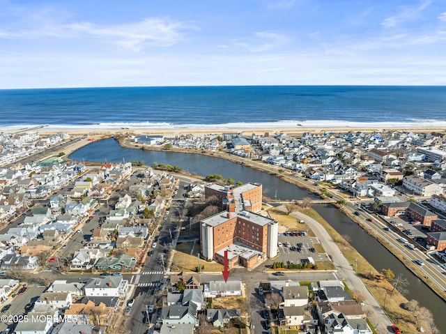 aerial view with a residential view and a water view