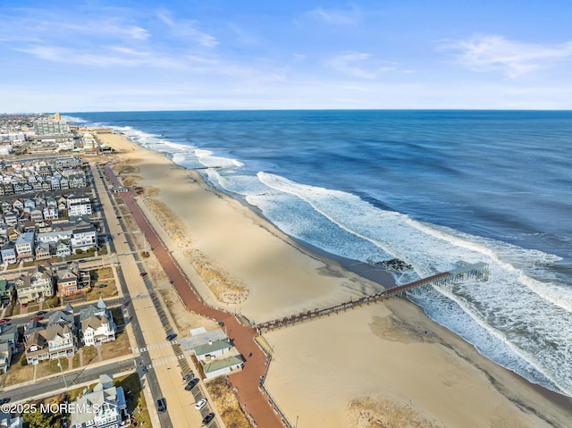 aerial view featuring a water view and a beach view