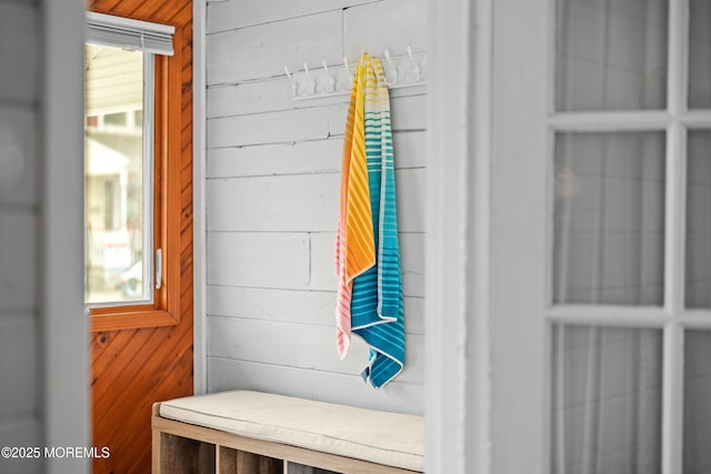 mudroom with wooden walls