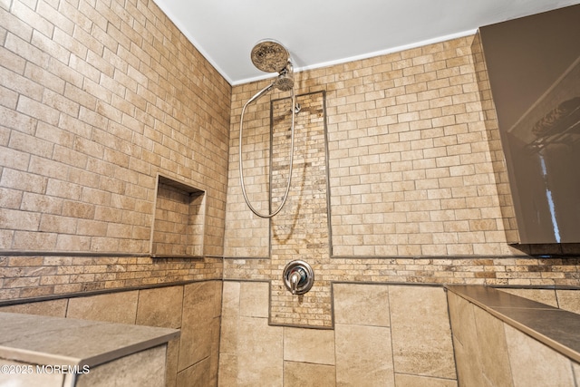 bathroom featuring a tile shower