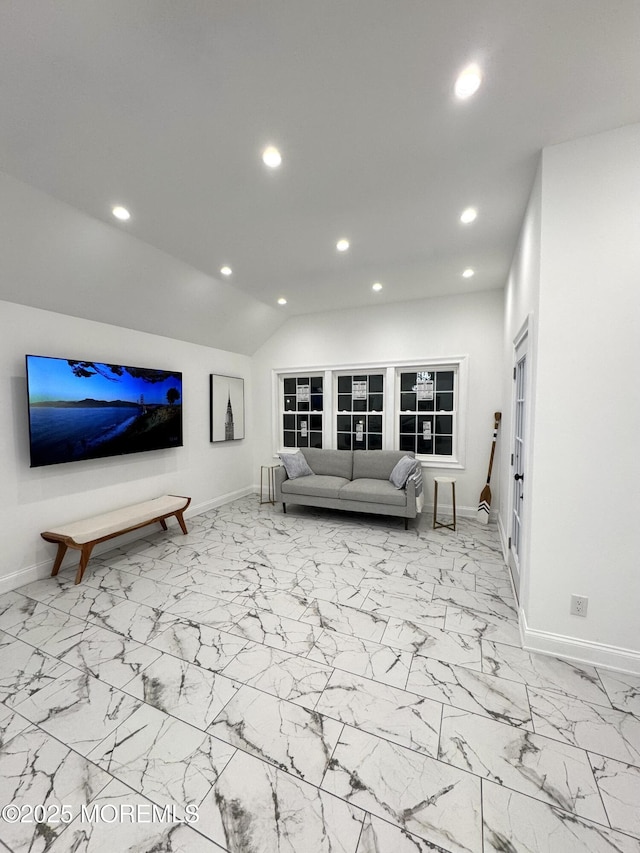 living room featuring lofted ceiling