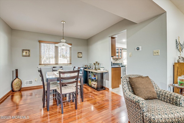 dining room with light hardwood / wood-style flooring