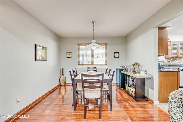 dining room with light wood-type flooring