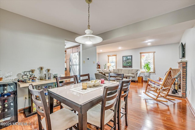 dining space with light hardwood / wood-style floors