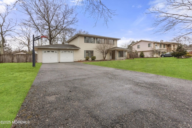 view of front of property with a garage and a front yard