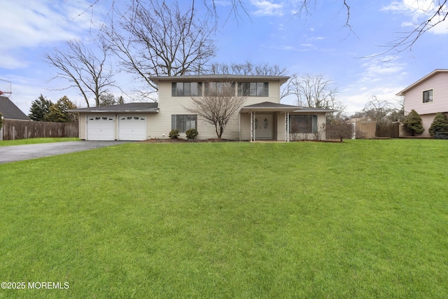 view of front of home featuring a garage and a front lawn